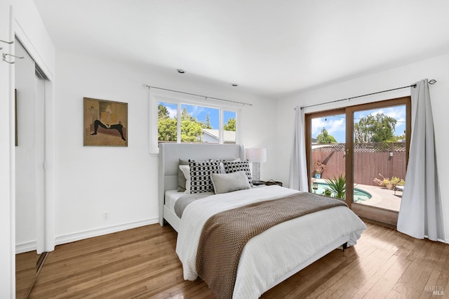 480 Via Del Plano, Novato, CA 94949 - bedroom with access to outside, hardwood / wood-style floors, and baseboards