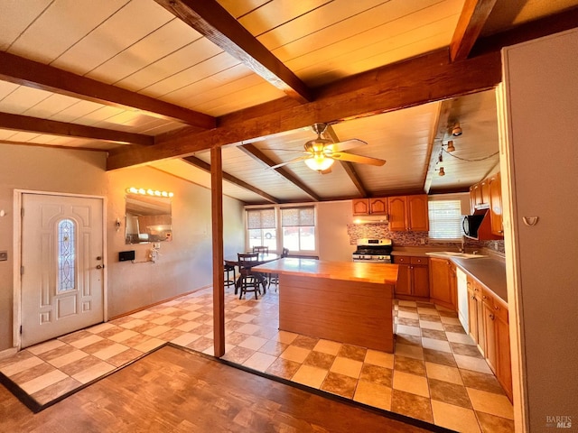423 Gardiner Way, Rio Vista, CA 94571 - kitchen with stainless steel gas range, a kitchen island, a ceiling fan, tasteful backsplash, and white dishwasher