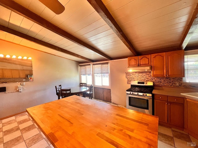 423 Gardiner Way, Rio Vista, CA 94571 - kitchen featuring stainless steel gas range, under cabinet range hood, butcher block countertops, plenty of natural light, and wooden ceiling with exposed beams