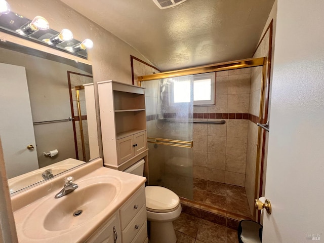 423 Gardiner Way, Rio Vista, CA 94571 - bathroom featuring toilet, lofted ceiling, a shower stall, vanity, and tile patterned flooring