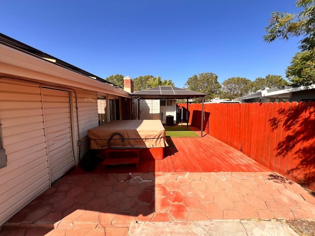 423 Gardiner Way, Rio Vista, CA 94571 - fenced backyard featuring a hot tub, a gazebo, a deck, and central air condition unit