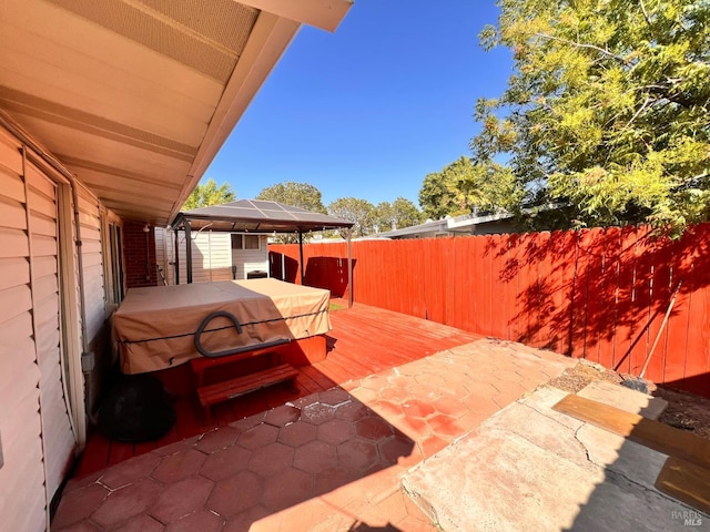 423 Gardiner Way, Rio Vista, CA 94571 - wooden deck with a hot tub, a gazebo, a fenced backyard, and a patio