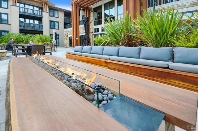 1314 Mckinstry St Unit 2008, Napa, CA 94559 - surrounding community featuring an outdoor living space with a fire pit and a patio