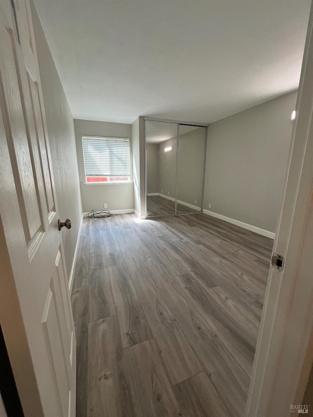 2525 Walters Way Unit 19, Concord, CA 94520 - unfurnished bedroom featuring wood finished floors and baseboards