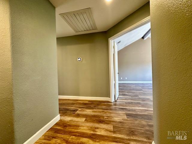 1540 Mccarthy Ct, Dixon, CA 95620 - hall with wood finished floors and a textured wall