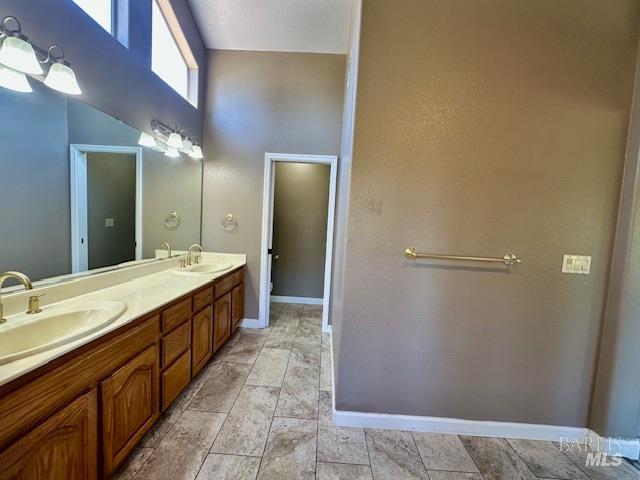 1540 Mccarthy Ct, Dixon, CA 95620 - full bath featuring double vanity and a towering ceiling