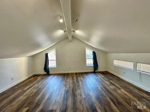 1540 Mccarthy Ct, Dixon, CA 95620 - bonus room featuring dark wood-style floors, plenty of natural light, and a textured ceiling