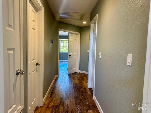 1540 Mccarthy Ct, Dixon, CA 95620 - hallway featuring dark wood finished floors and baseboards