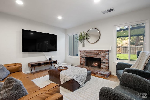 1800 London Dr, Benicia, CA 94510 - living area featuring wood finished floors, a fireplace, recessed lighting, and baseboards