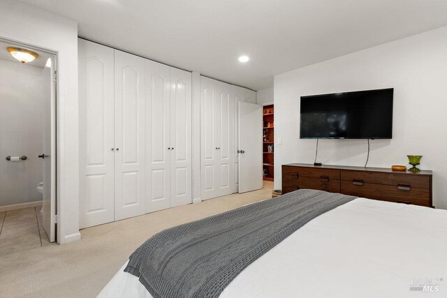 1800 London Dr, Benicia, CA 94510 - carpeted bedroom featuring baseboards, recessed lighting, and ensuite bathroom