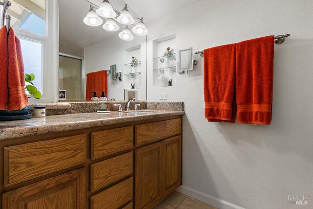 1800 London Dr, Benicia, CA 94510 - bathroom featuring vanity, a stall shower, tile patterned flooring, and baseboards