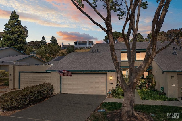 1800 London Dr, Benicia, CA 94510 - view of front of home with a garage, driveway, and stucco siding