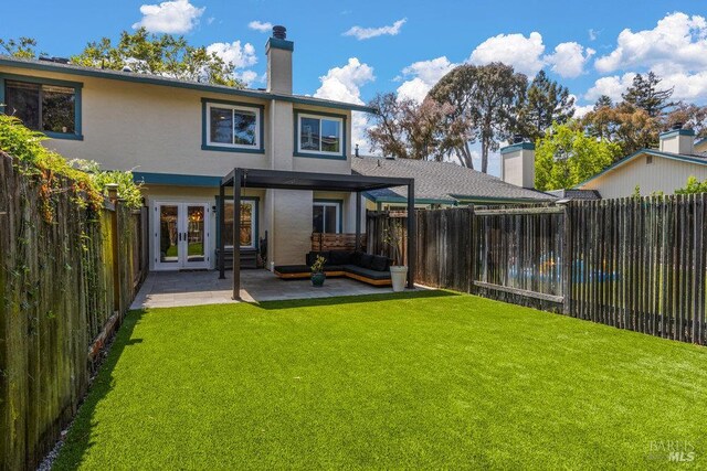 1800 London Dr, Benicia, CA 94510 - rear view of house with french doors, a patio, an outdoor living space, stucco siding, and a chimney