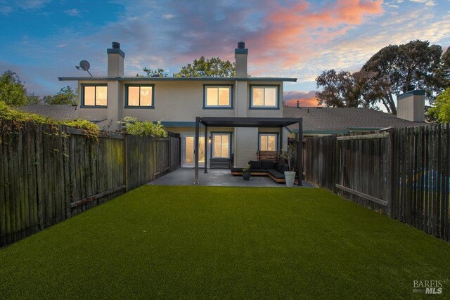 1800 London Dr, Benicia, CA 94510 - rear view of house with a patio, an outdoor hangout area, stucco siding, and a chimney
