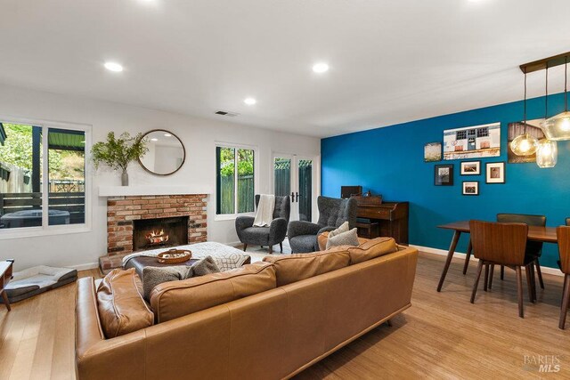 1800 London Dr, Benicia, CA 94510 - living room with light wood-type flooring, recessed lighting, baseboards, and a fireplace