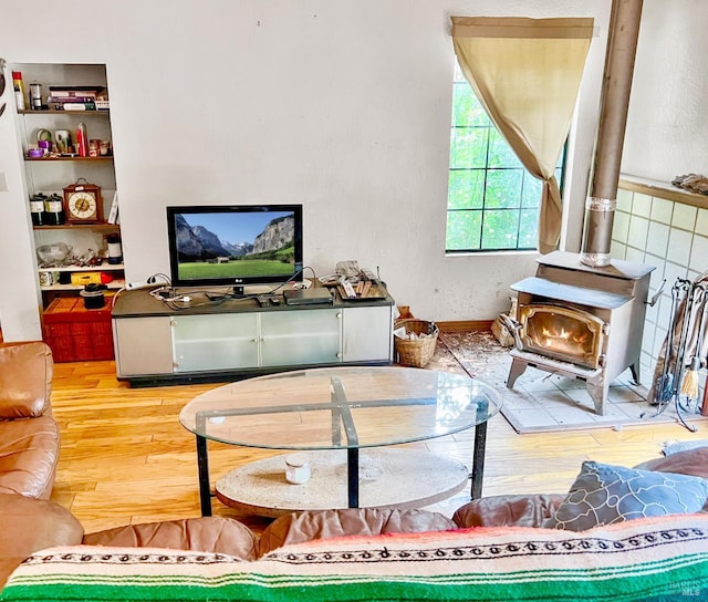 9826 Meadow Dr, Cobb, CA 95426 - living room with wood finished floors and a wood stove