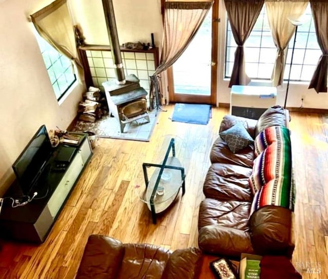 9826 Meadow Dr, Cobb, CA 95426 - living area featuring wood finished floors and a wood stove