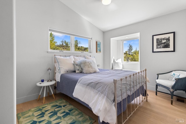 11150 Van Dorn Reservoir Rd, Middletown, CA 95461 - bedroom featuring lofted ceiling, wood finished floors, and baseboards
