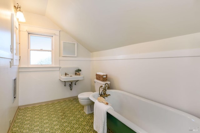 8 Keller St, Petaluma, CA 94952 - bathroom with a freestanding tub, toilet, vaulted ceiling, and tile patterned floors