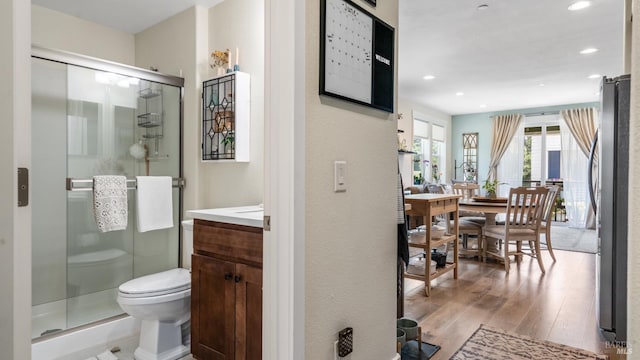 2676 Franz Kafka Ave, Santa Rosa, CA 95404 - full bathroom featuring vanity, wood finished floors, a stall shower, toilet, and recessed lighting