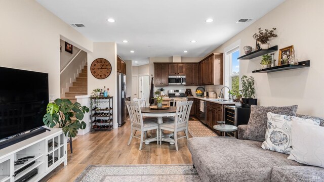 2676 Franz Kafka Ave, Santa Rosa, CA 95404 - dining area featuring recessed lighting, light wood finished floors, and stairs
