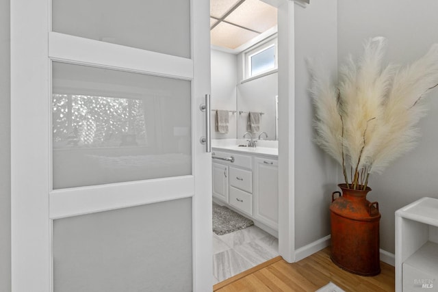 6518 Meadowgreen Pl, Santa Rosa, CA 95409 - bathroom with vanity, wood finished floors, and baseboards