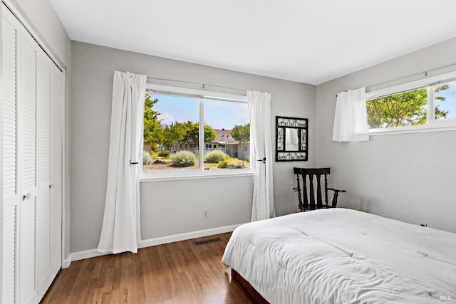 6518 Meadowgreen Pl, Santa Rosa, CA 95409 - bedroom featuring a closet, wood finished floors, and baseboards