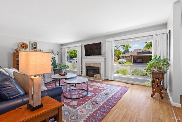 6518 Meadowgreen Pl, Santa Rosa, CA 95409 - living room featuring wood finished floors and a tiled fireplace