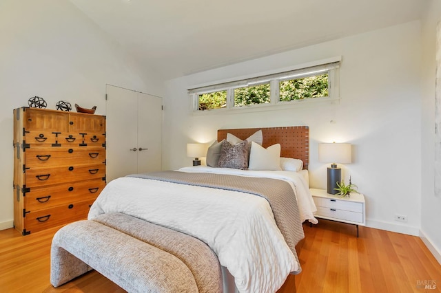 3 Wainwright Pl, Mill Valley, CA 94941 - bedroom with light wood-style floors, baseboards, vaulted ceiling, and a closet