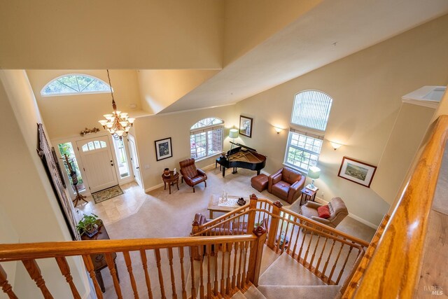 230 Clear Ridge Dr, Healdsburg, CA 95448 - carpeted foyer entrance featuring healthy amount of natural light, high vaulted ceiling, baseboards, a chandelier, and stairs