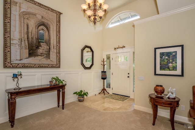 230 Clear Ridge Dr, Healdsburg, CA 95448 - entryway with a chandelier, carpet, a wainscoted wall, and a decorative wall