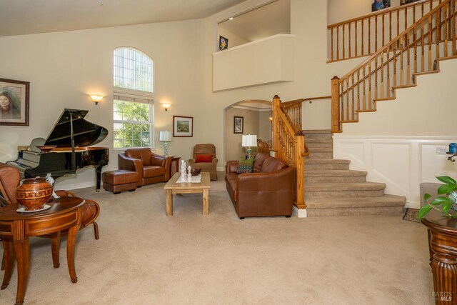 230 Clear Ridge Dr, Healdsburg, CA 95448 - living room with arched walkways, carpet, high vaulted ceiling, and stairway