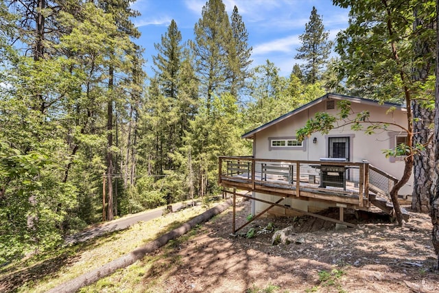 16545 Mountain View Dr, Cobb, CA 95426 - back of property featuring a wooden deck and a forest view