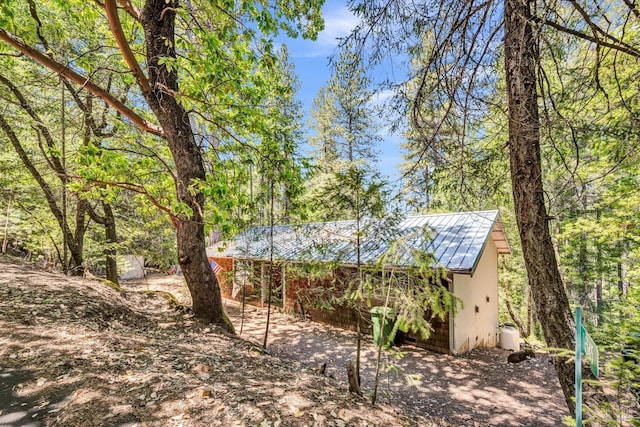 16545 Mountain View Dr, Cobb, CA 95426 - view of front facade featuring metal roof and an outbuilding