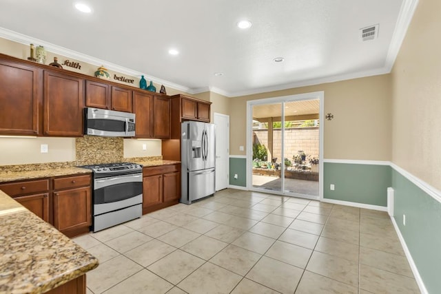 7437 Bloomsbury Way, Elk Grove, CA 95757 - kitchen with stainless steel appliances, tasteful backsplash, light tile patterned flooring, light stone countertops, and crown molding