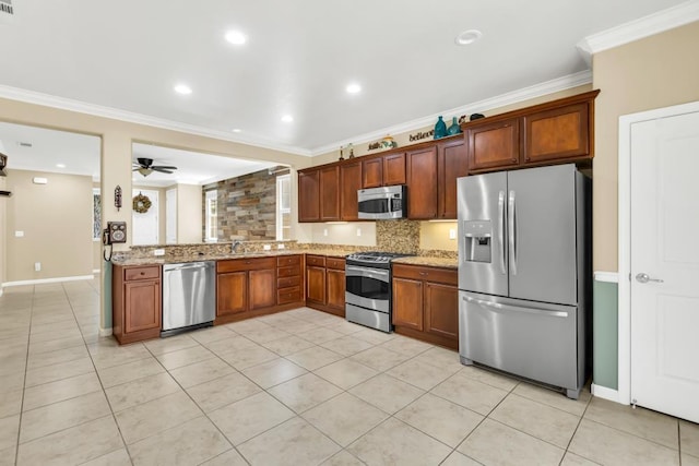7437 Bloomsbury Way, Elk Grove, CA 95757 - kitchen with stainless steel appliances, light stone counters, crown molding, backsplash, and light tile patterned floors