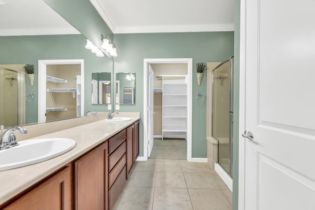 7437 Bloomsbury Way, Elk Grove, CA 95757 - bathroom with a walk in closet, a shower stall, double vanity, crown molding, and baseboards