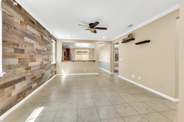 7437 Bloomsbury Way, Elk Grove, CA 95757 - unfurnished room with ceiling fan, crown molding, light tile patterned flooring, wooden walls, and an accent wall