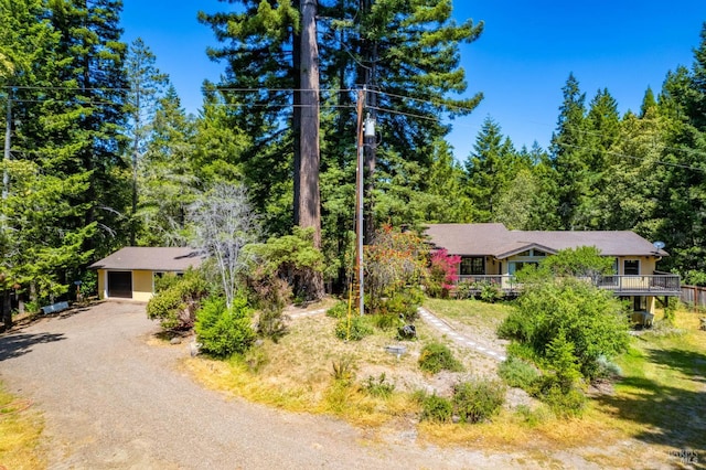7701 Signal Ridge Rd, Philo, CA 95466 - view of property hidden behind natural elements featuring driveway, a garage, and a forest view
