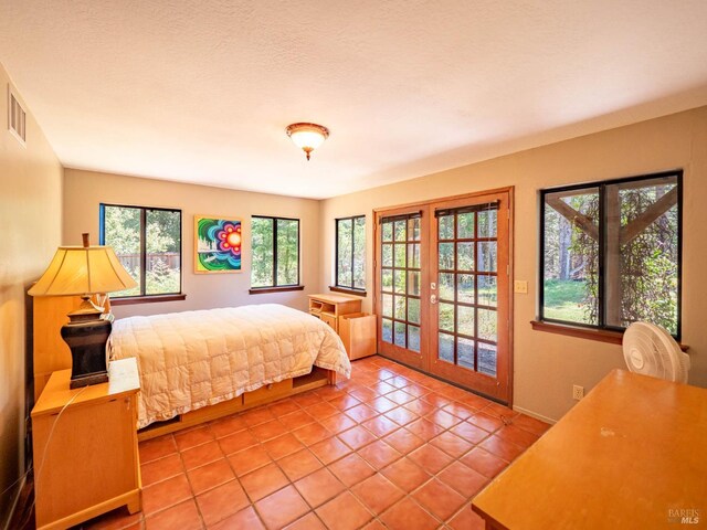 7701 Signal Ridge Rd, Philo, CA 95466 - bedroom with access to outside, tile patterned floors, and french doors