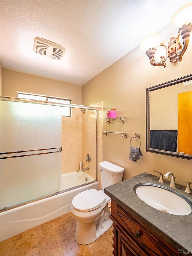 7701 Signal Ridge Rd, Philo, CA 95466 - bathroom featuring vanity, bath / shower combo with glass door, toilet, and tile patterned floors