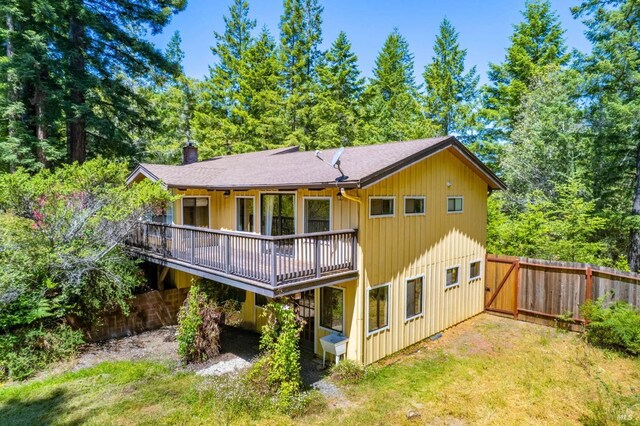 7701 Signal Ridge Rd, Philo, CA 95466 - back of property featuring a chimney, a wooden deck, and roof with shingles