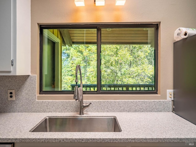 7701 Signal Ridge Rd, Philo, CA 95466 - kitchen with a sink, tasteful backsplash, and white cabinetry