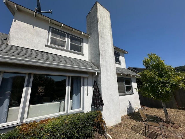 17 Sonora Way, Corte Madera, CA 94925 - rear view of house with stucco siding, roof with shingles, and a chimney