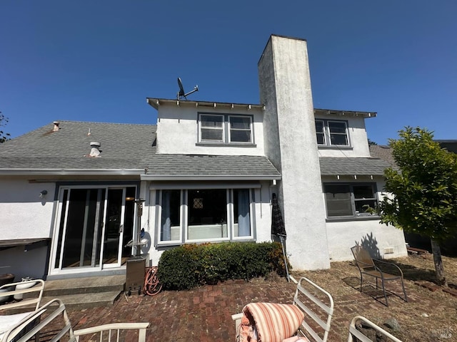 17 Sonora Way, Corte Madera, CA 94925 - back of house featuring stucco siding, a shingled roof, and a chimney