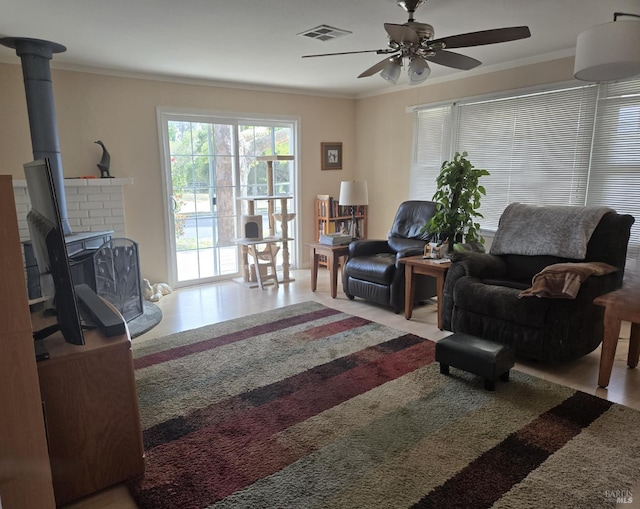 292 Palm Ave, Penngrove, CA 94951 - living area featuring ceiling fan, crown molding, and a wood stove