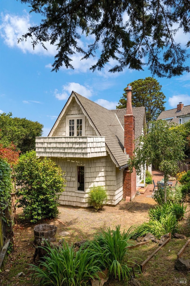 995 Greenhill Rd, Mill Valley, CA 94941 - view of side of home with a chimney and roof with shingles