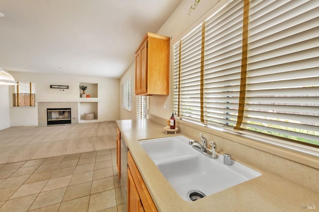 8046 Mason Dr, Rohnert Park, CA 94928 - kitchen with a sink, light tile patterned floors, a fireplace, light countertops, and light colored carpet