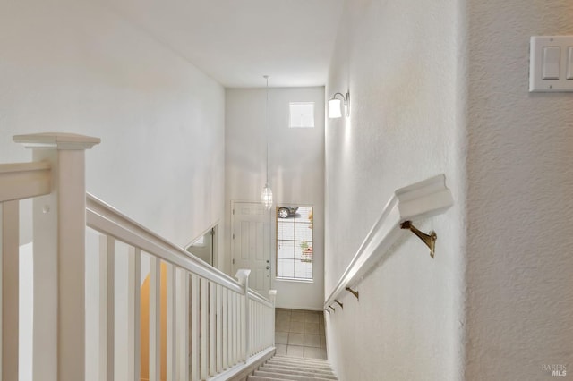 8046 Mason Dr, Rohnert Park, CA 94928 - staircase with tile patterned floors and a towering ceiling