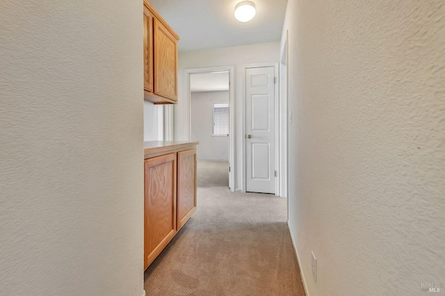 8046 Mason Dr, Rohnert Park, CA 94928 - hallway featuring light carpet and a textured wall